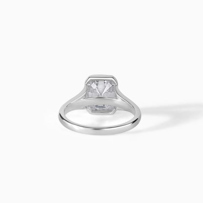 9x7mm Emerald Cut Moissanite Engagement Ring: Silver Bezel Split Shank Design