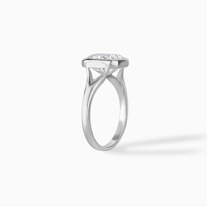 9x7mm Emerald Cut Moissanite Engagement Ring: Silver Bezel Split Shank Design