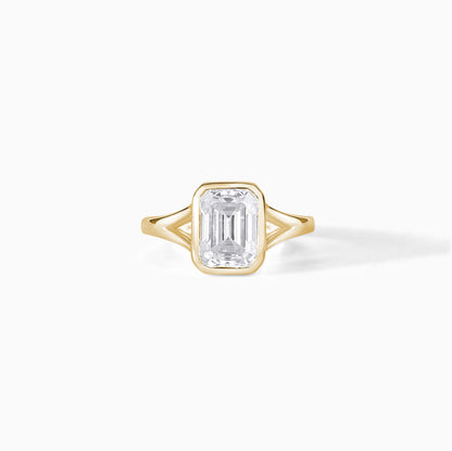 9x7mm Emerald Cut Moissanite Engagement Ring: Silver Bezel Split Shank Design